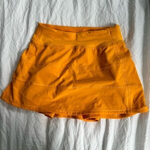 Lululemon orange pace rival midrise skirt size 2 Tall